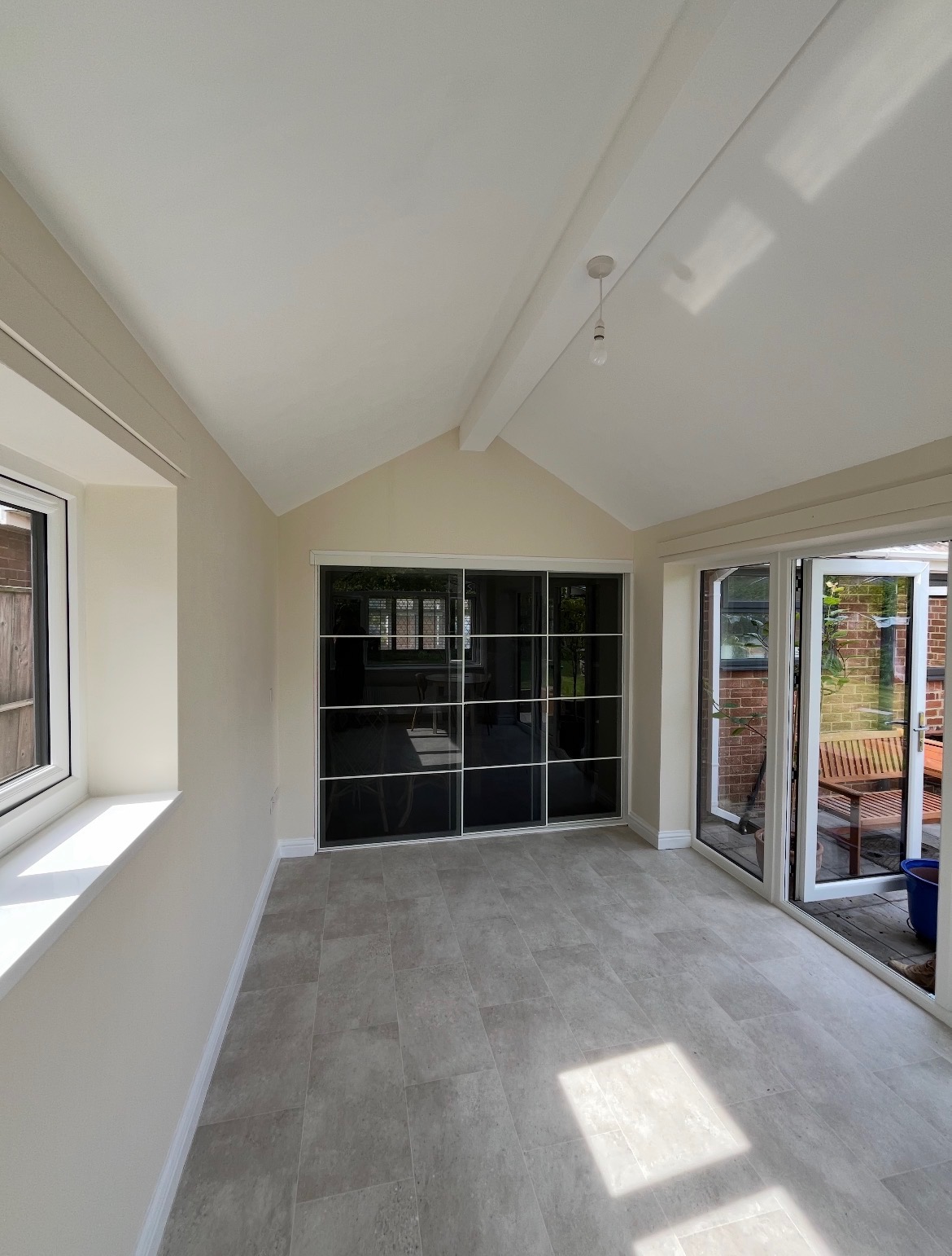 Renovated garden room interior with vaulted ceiling